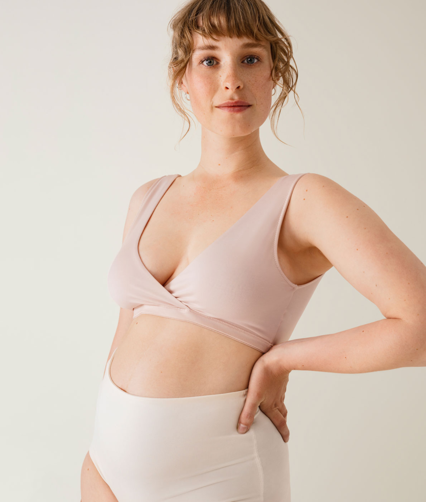 women posing for photo wearing bikini type attire
