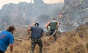 evacuation efforts amid historic heat wave and raging wildfires in Greece.