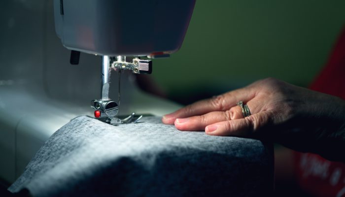 women sewing fabric
