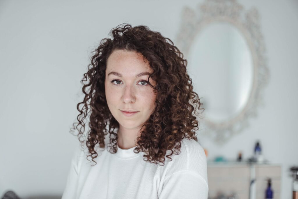 portrait photo of a curl haired women