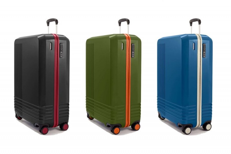 three different colored luggage