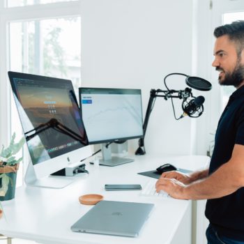 person podcasting in front of iMac