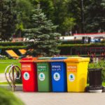 four multicolored trashcan