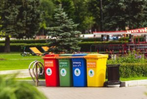 four multicolored trashcan