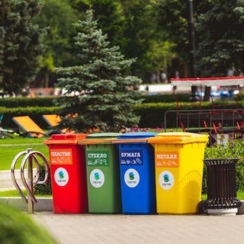 four multicolored trashcan
