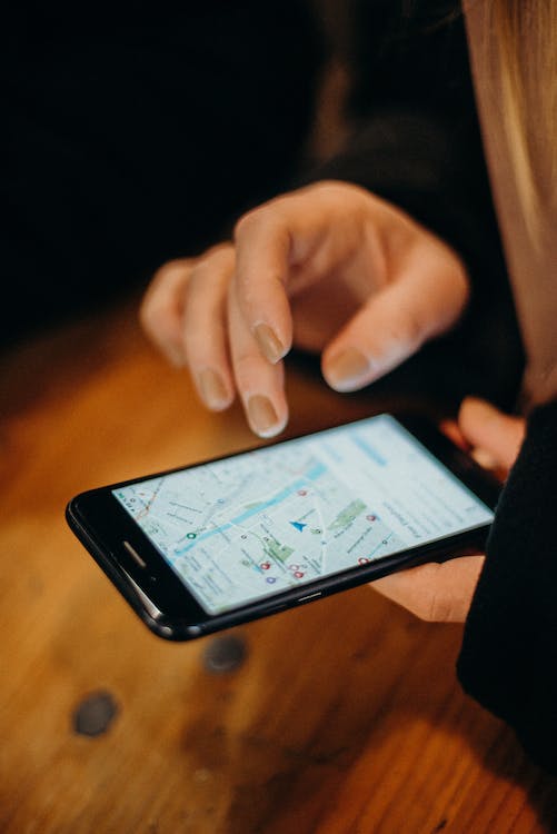 person using map in smartphone
