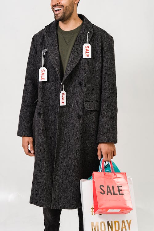 sale tag hanging on long coat 