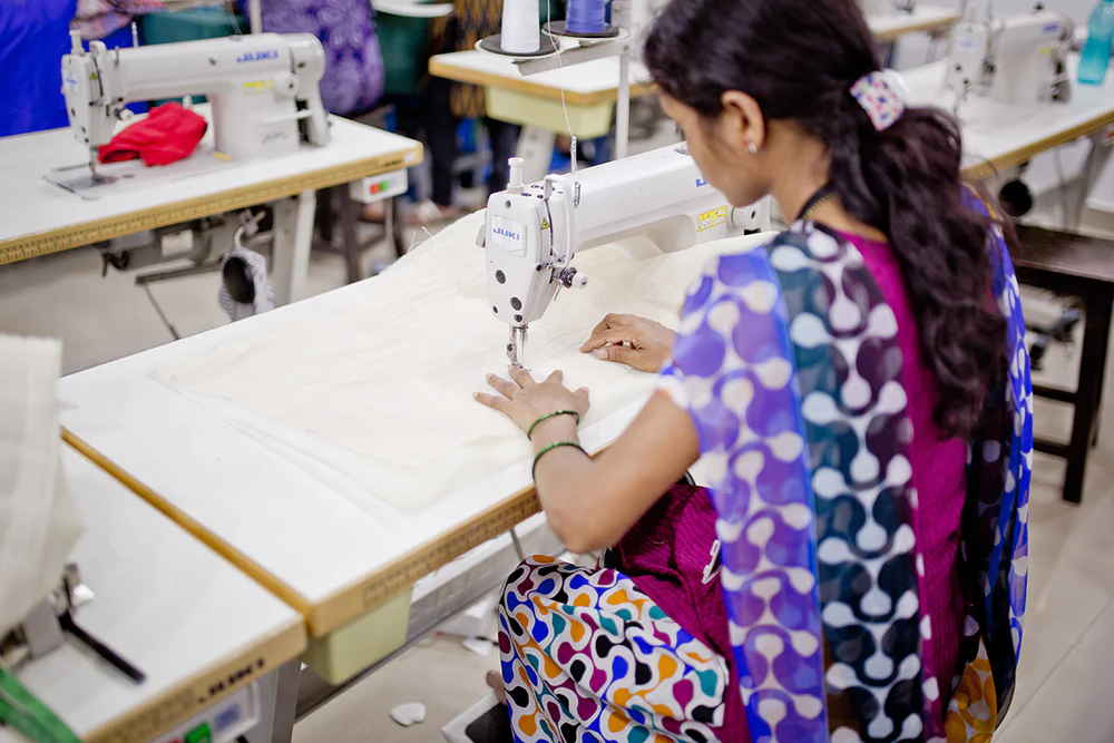 women sewing with automated sewing machine