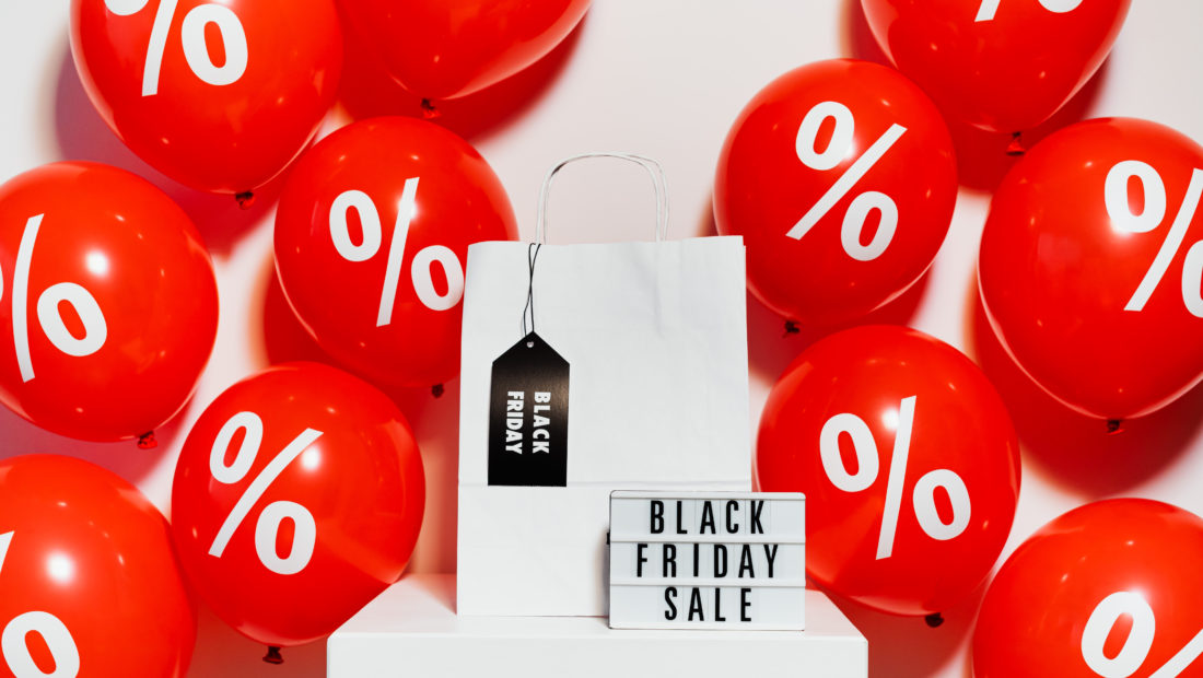 red colored round shaped ball drawn percentage on them beside a tag written black Friday sale on it