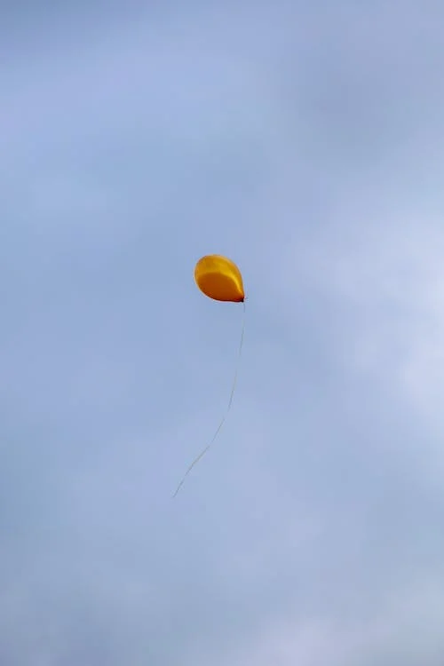 a balloon flying in the sky