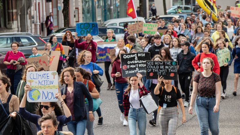 a group of people protesting concerning climate change