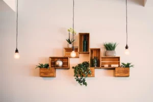 wooden wall decor with lamp and green plants