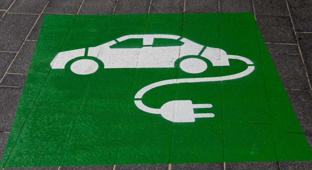 spray painted Car charging sign