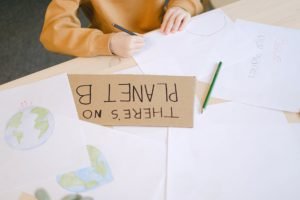 woman Drawing at a Desk in a Classroom
