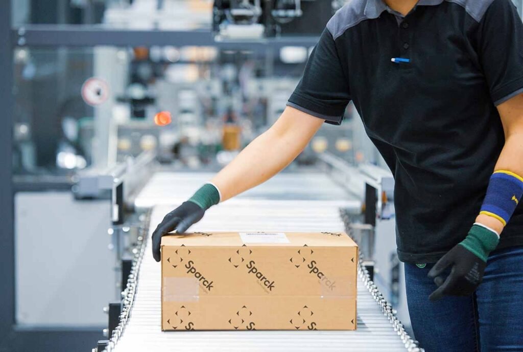 a male person checking automated packaging