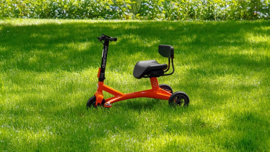 An electric scooter on a green grass field